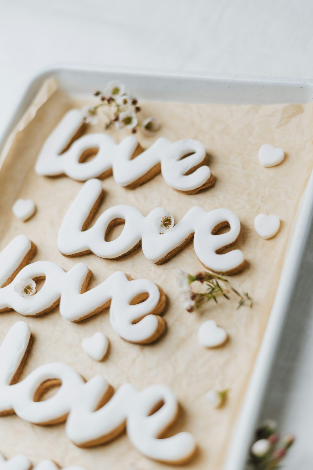 a tray of cookies with the words love spelled out