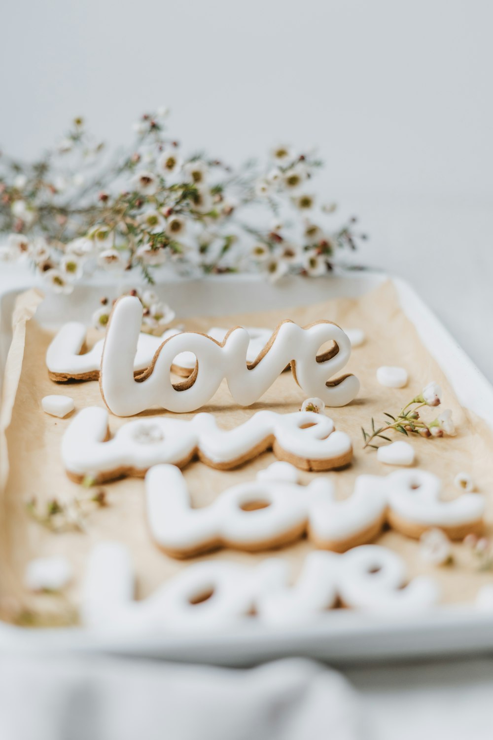 a tray of cookies with the word love spelled out
