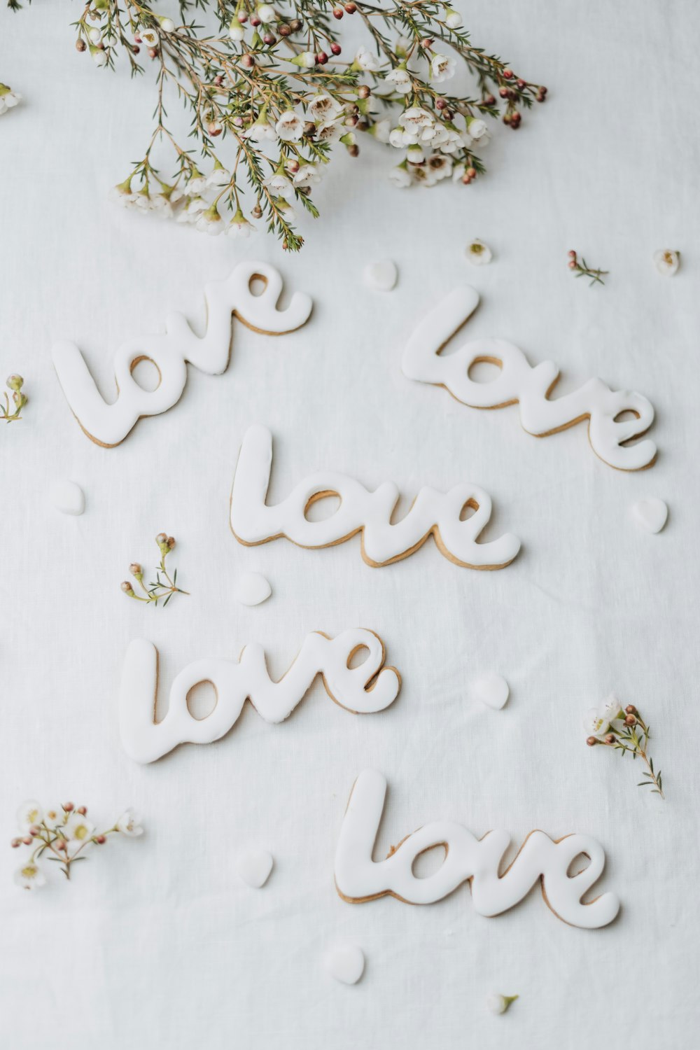the words love and love spelled out on a sheet of paper