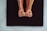 A close-up of a customer wearing snuggérhuggr grip socks during a yoga session.