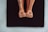 A close-up of a customer wearing snuggérhuggr grip socks during a yoga session.