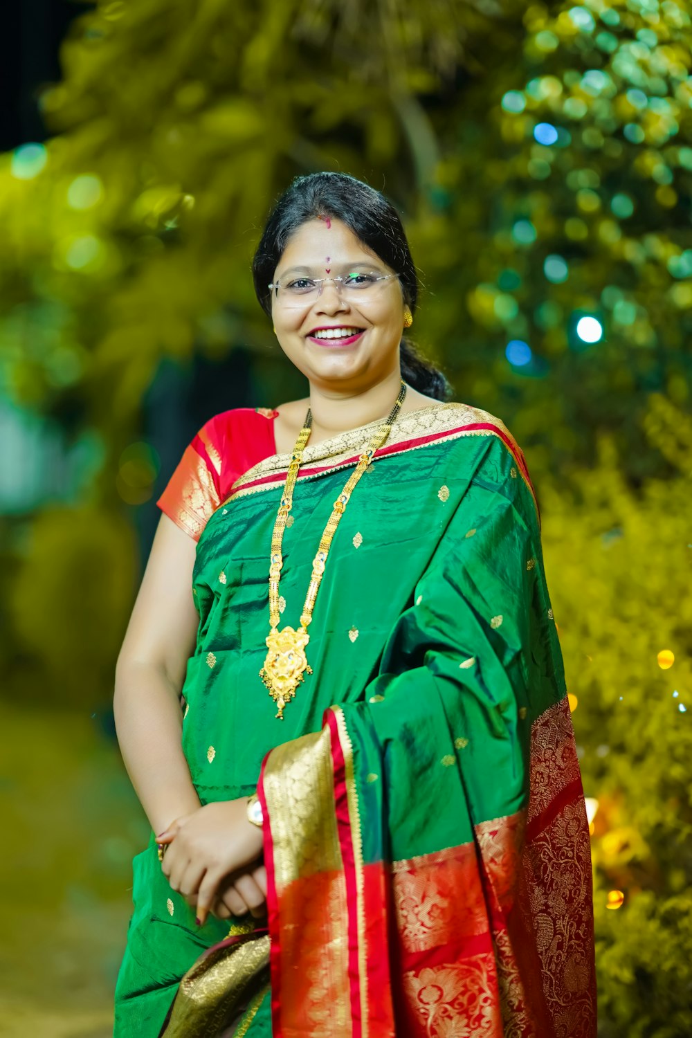 a woman in a green and red sari