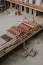 a large building under construction with a crane