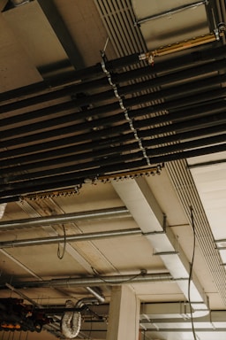 a room with a bunch of pipes and a clock