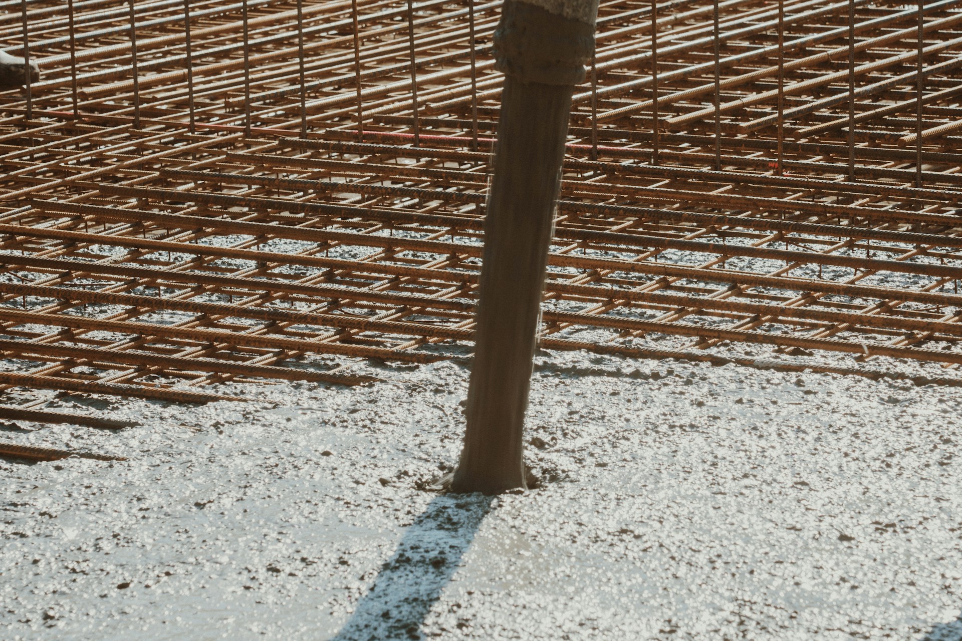 a man standing next to a building under construction