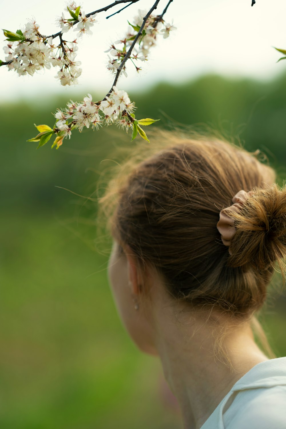 a woman with a flower in her hair