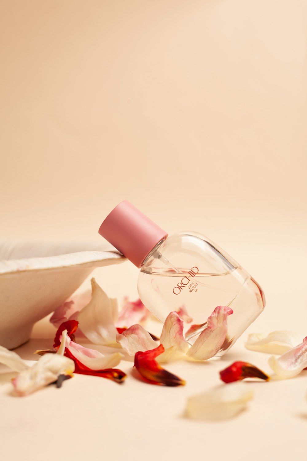 a bottle of perfume sitting on top of a table