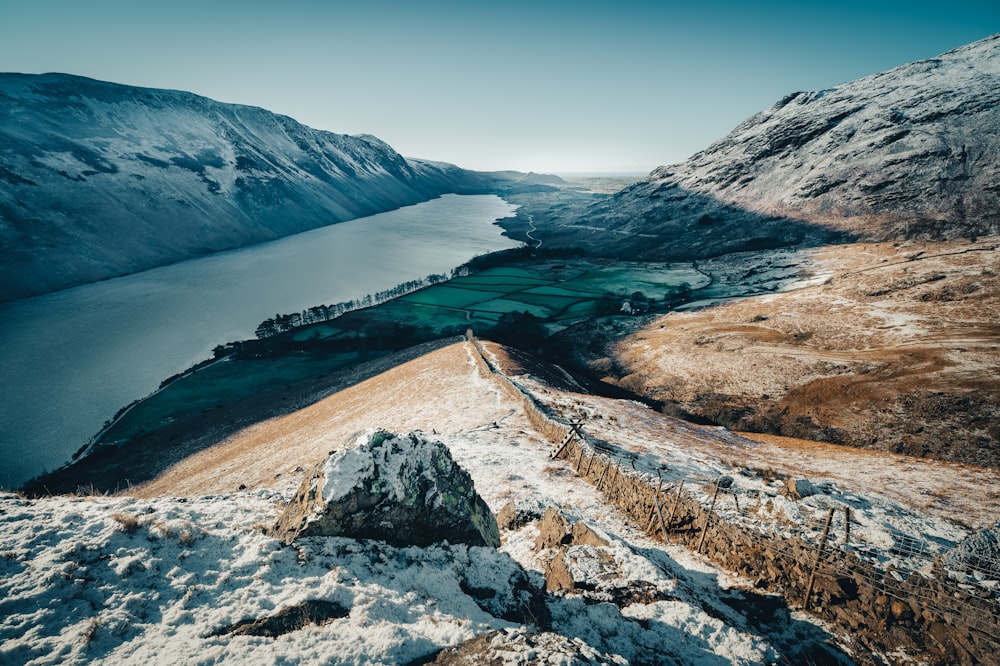 a view of a lake and mountains from a high point of view