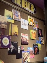 A colorful collage of Beatles album covers spanning their career.