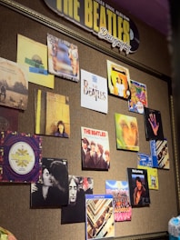 A vibrant collage featuring iconic Beatles album covers and band photos.