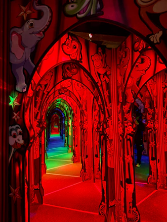 A bright, welcoming school hallway filled with students and colorful artwork.