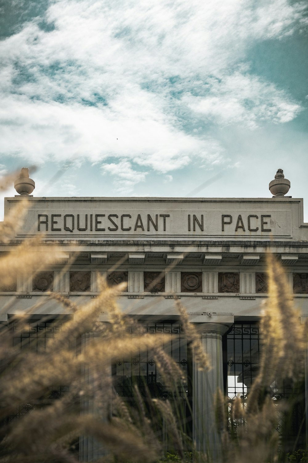 a tall building with a sign on top of it