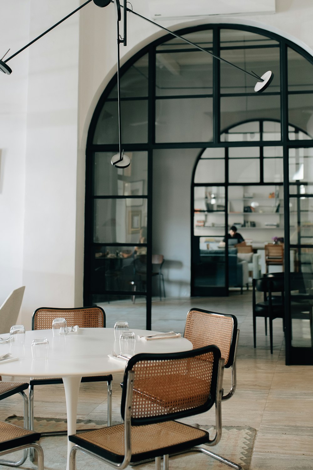 a dining room with chairs and a table