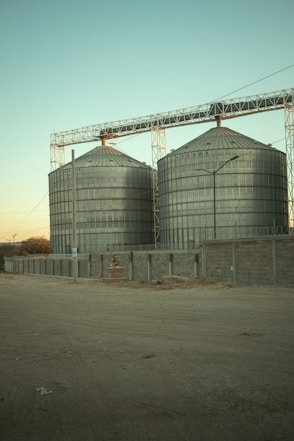 a couple of large metal tanks sitting next to each other