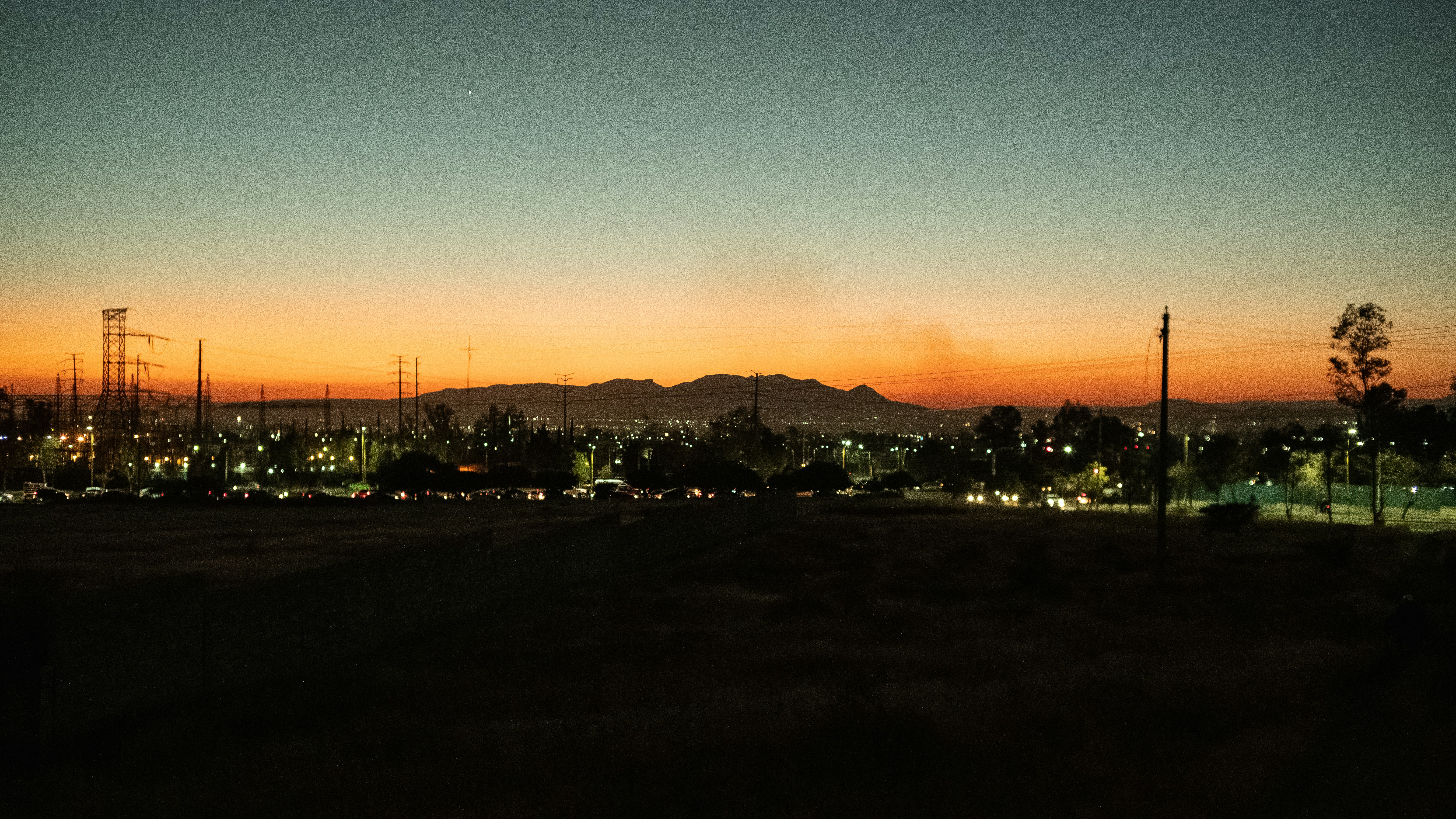 a view of a city at night from a distance