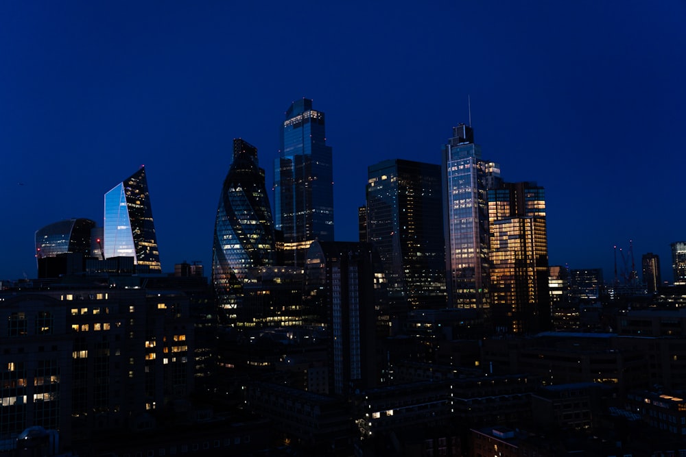 a view of a city at night from the top of a building