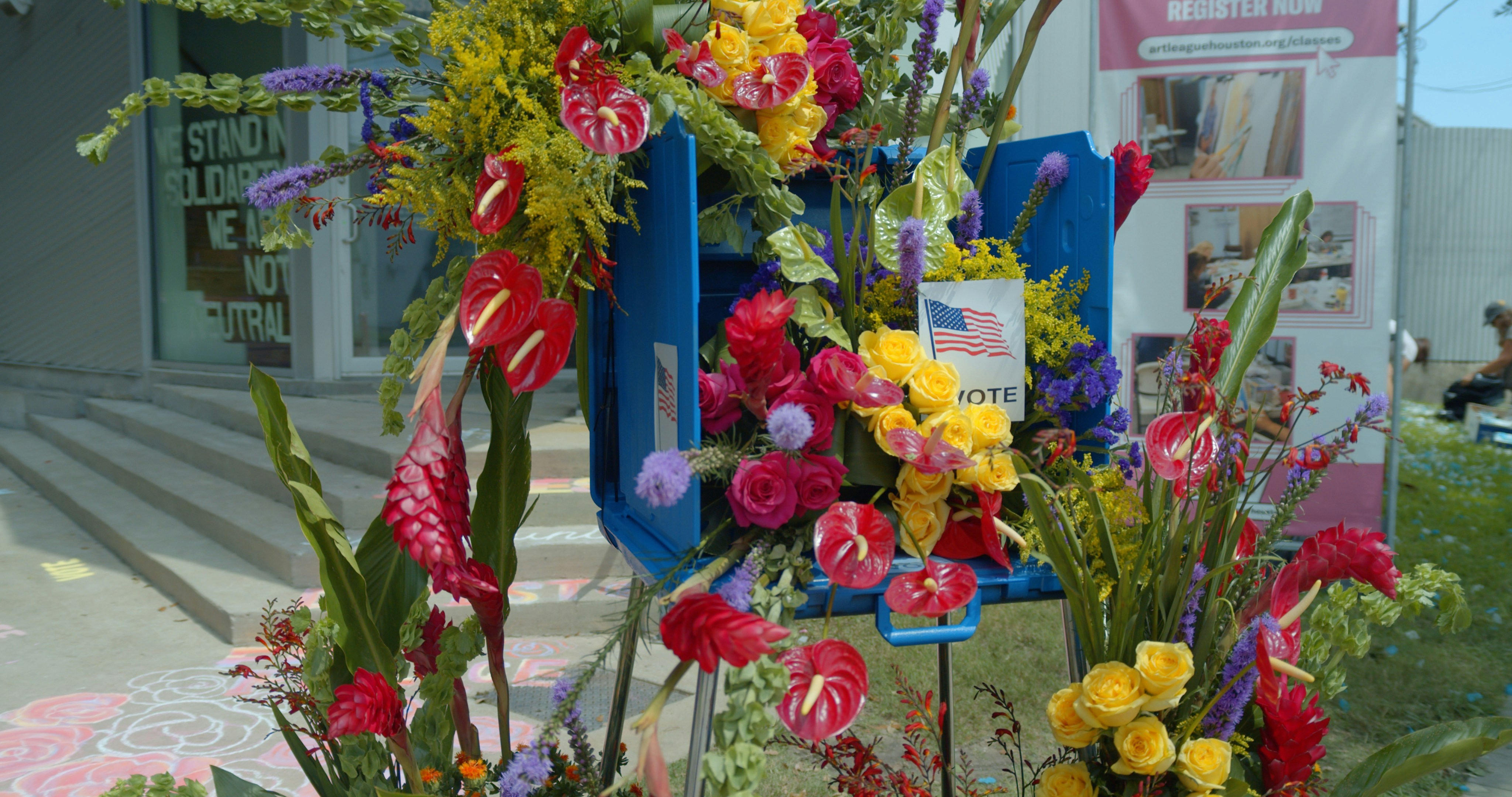 a bunch of flowers that are on a stand