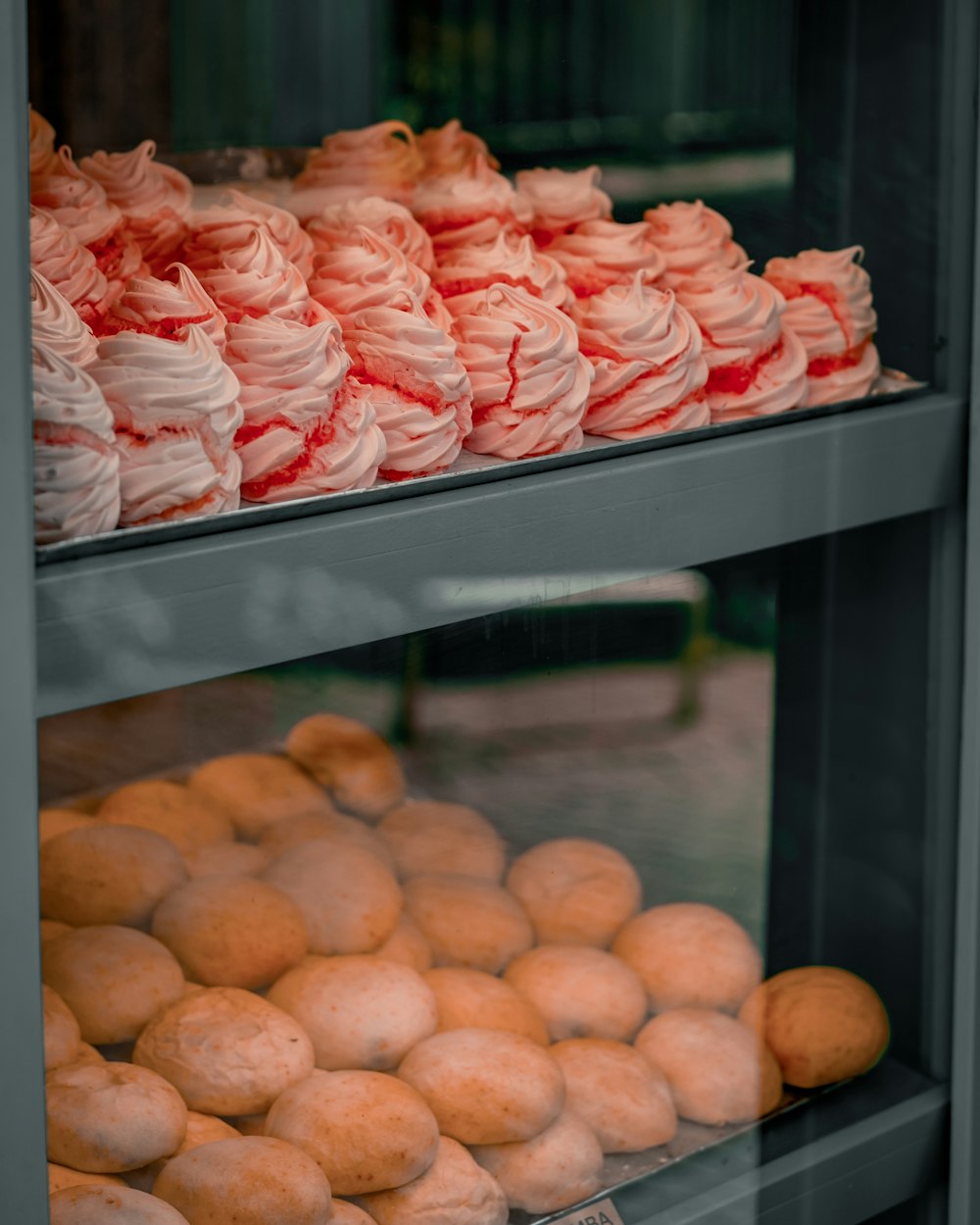 a display case filled with lots of different types of doughnuts