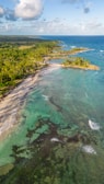 A breathtaking aerial view of a Caribbean coastline captured by a drone.