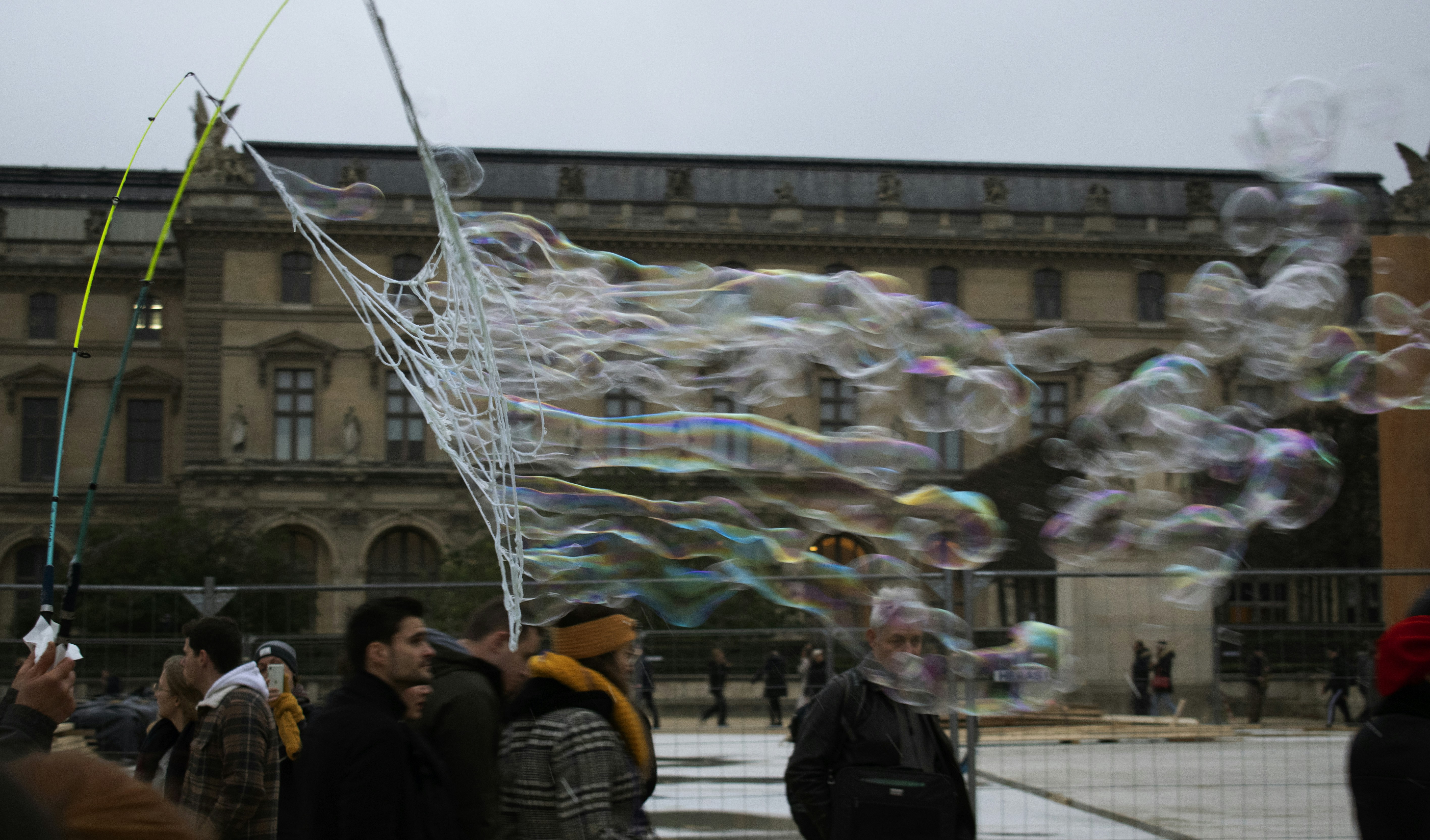a group of people standing in front of a building