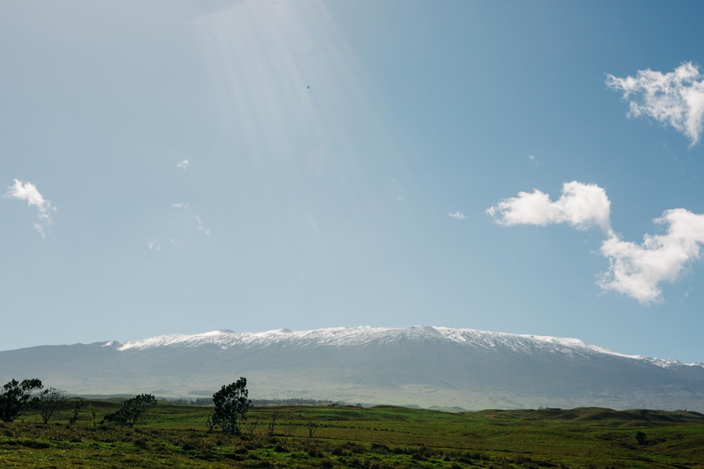 a view of a snow capped mountain in the distance