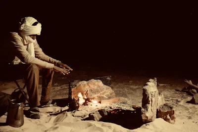 A traditional Berber campfire scene with travelers sharing stories under the stars.