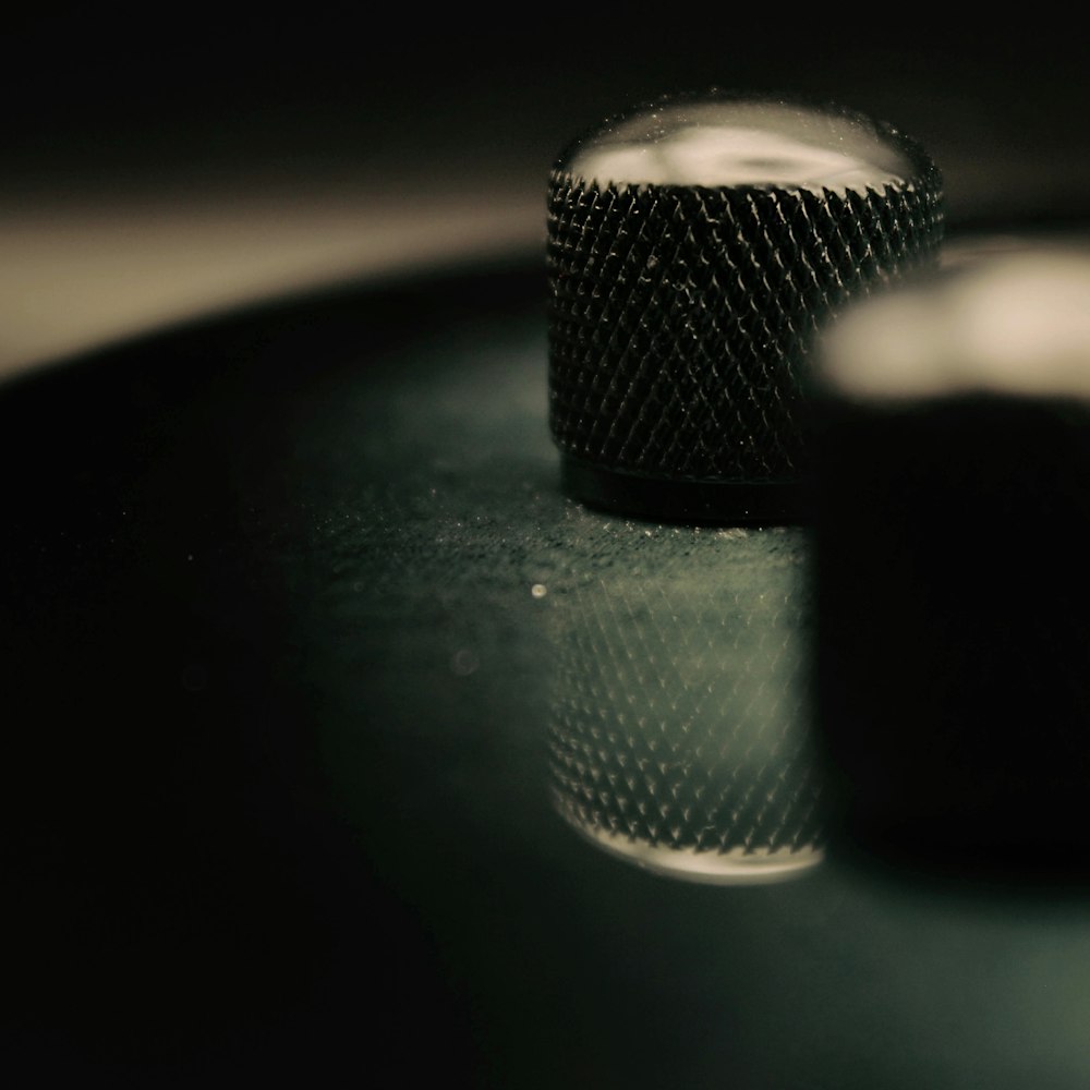 a close up of two microphones on a table