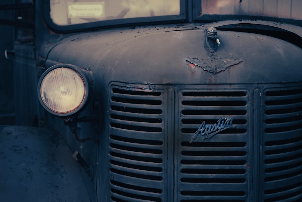 a close up of the front grill of an old truck