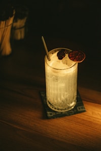 a drink with a spoon in it sitting on a table