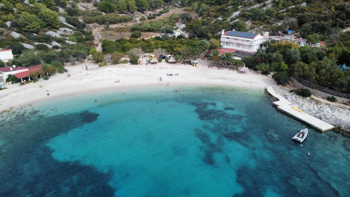 Hvar Town and harbour in May with calm clear water