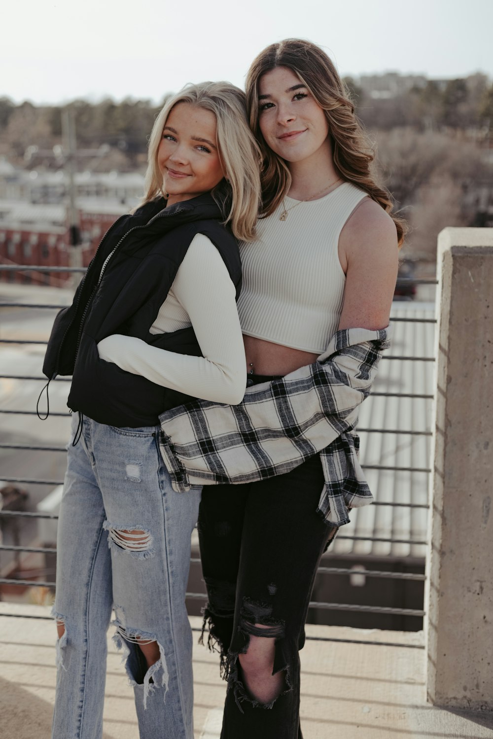 two beautiful women standing next to each other