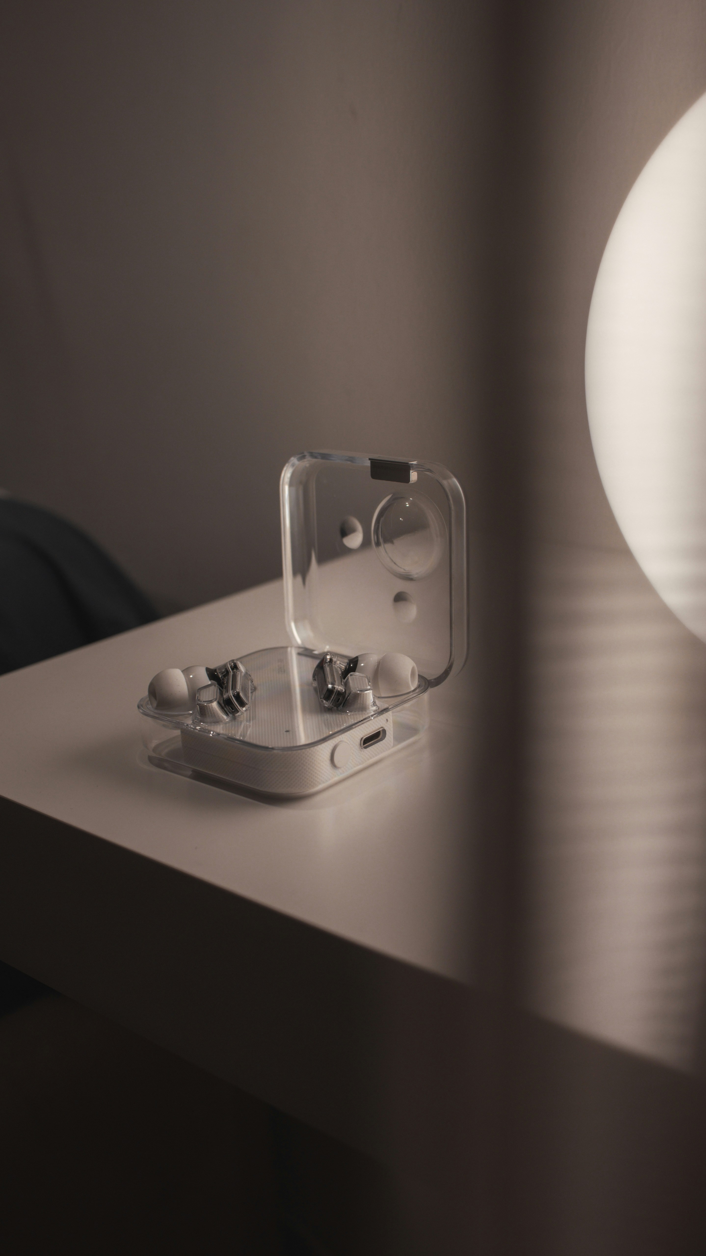 a pair of ear buds sitting on top of a table