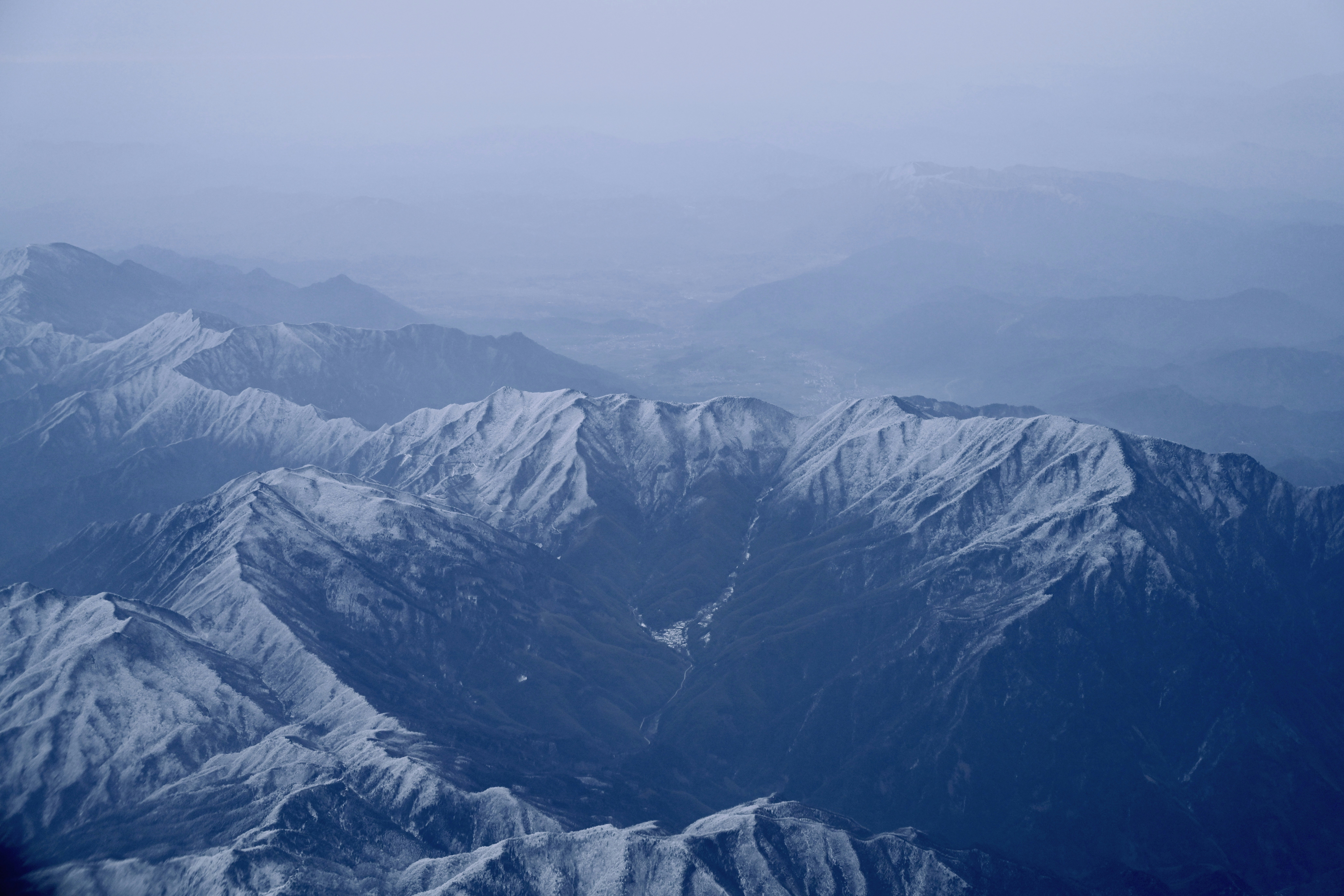 A view of a mountain range from an airplane