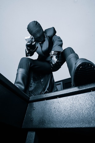 An intense action scene showing a sleek assassin in mid-leap, targeting a drug lord in a shadowy alley.