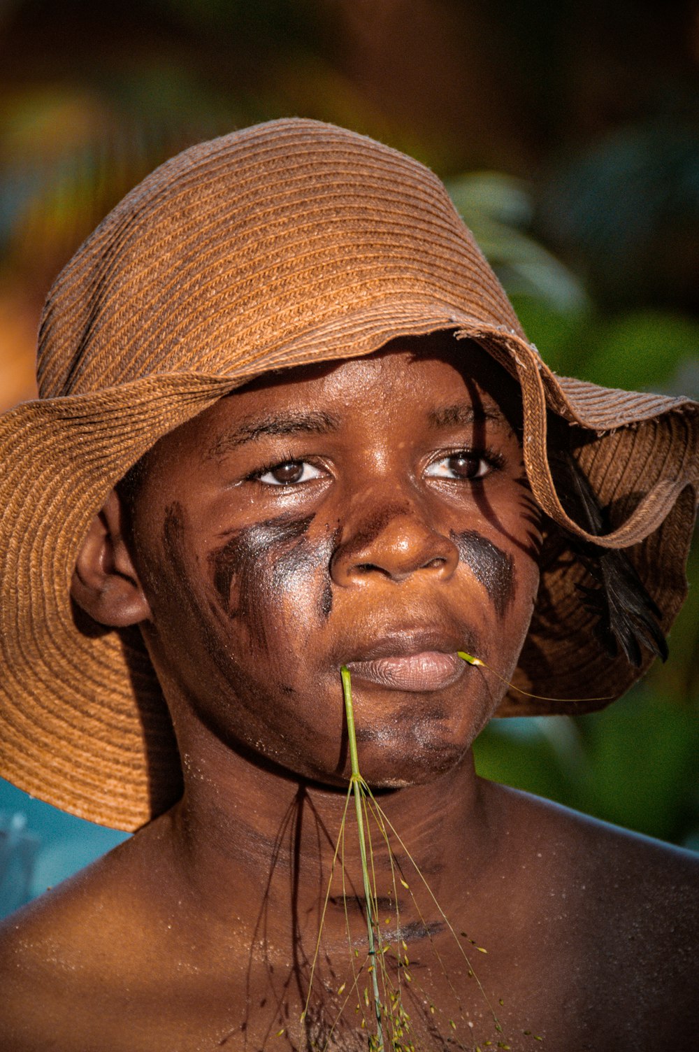 a man with a straw hat on his head