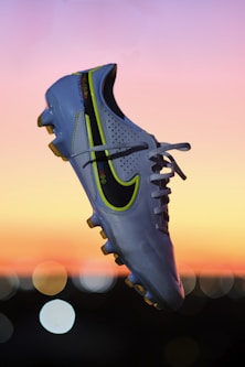 a pair of shoes that are in the air