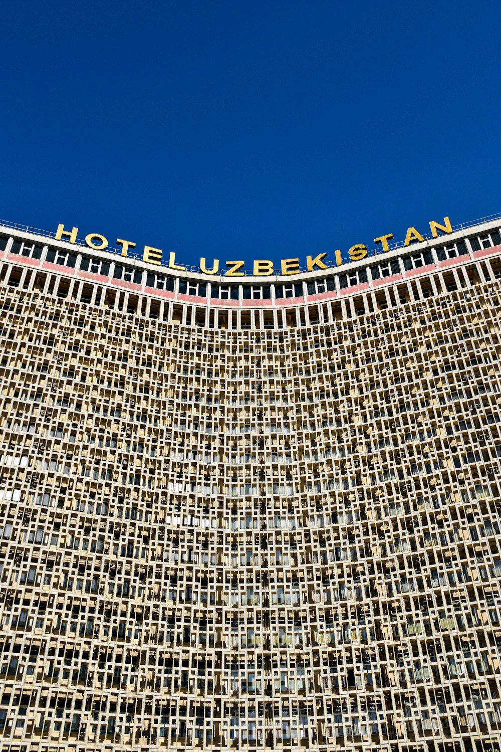 a very tall building with a sign on top of it