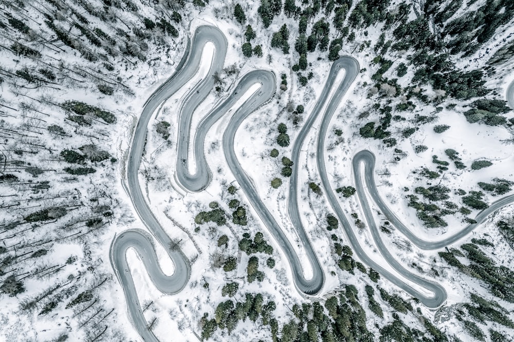 an aerial view of a snow covered road