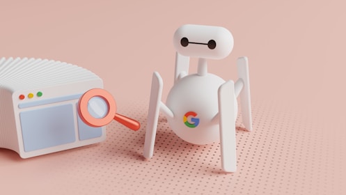 a small white robot next to a small white radio