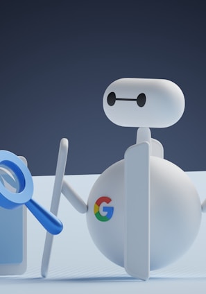 a white robot holding a magnifying glass next to a white box