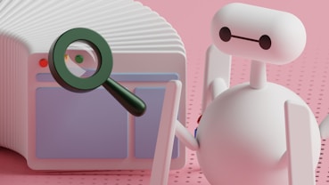 a white robot holding a magnifying glass