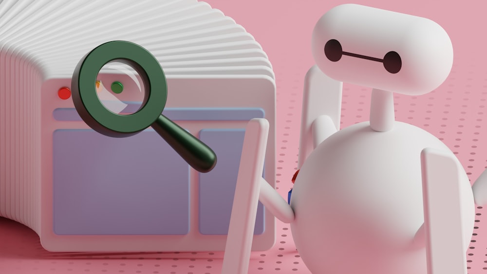 a white robot holding a magnifying glass