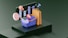 A 3D illustration featuring a series of shopping-related elements such as a shopping basket, a target, a lightbulb, a paper bag, and various charts or graphs. These objects are positioned on a dark green stepped platform, suggesting elements of business and marketing.