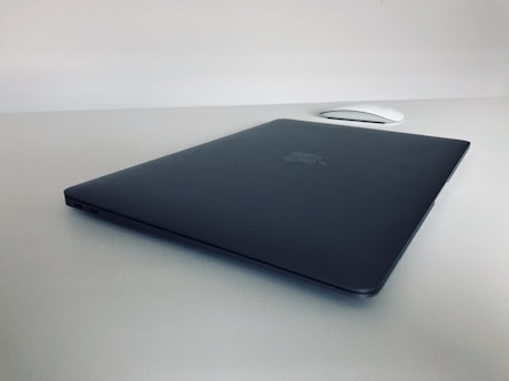 A sleek laptop on a minimalist desk.