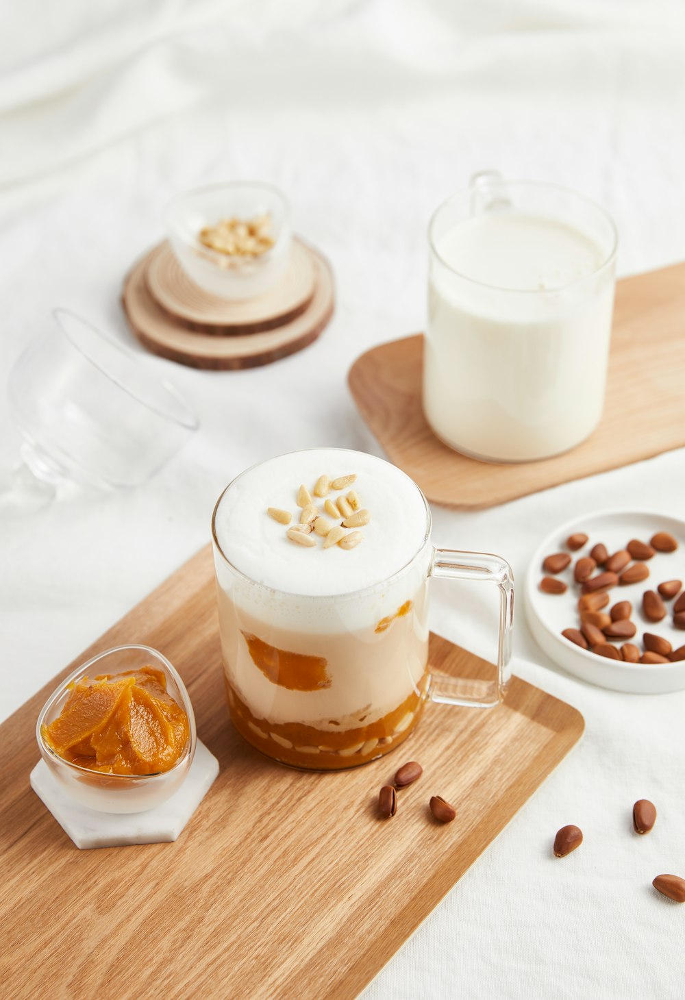 a dessert with nuts and milk on a table