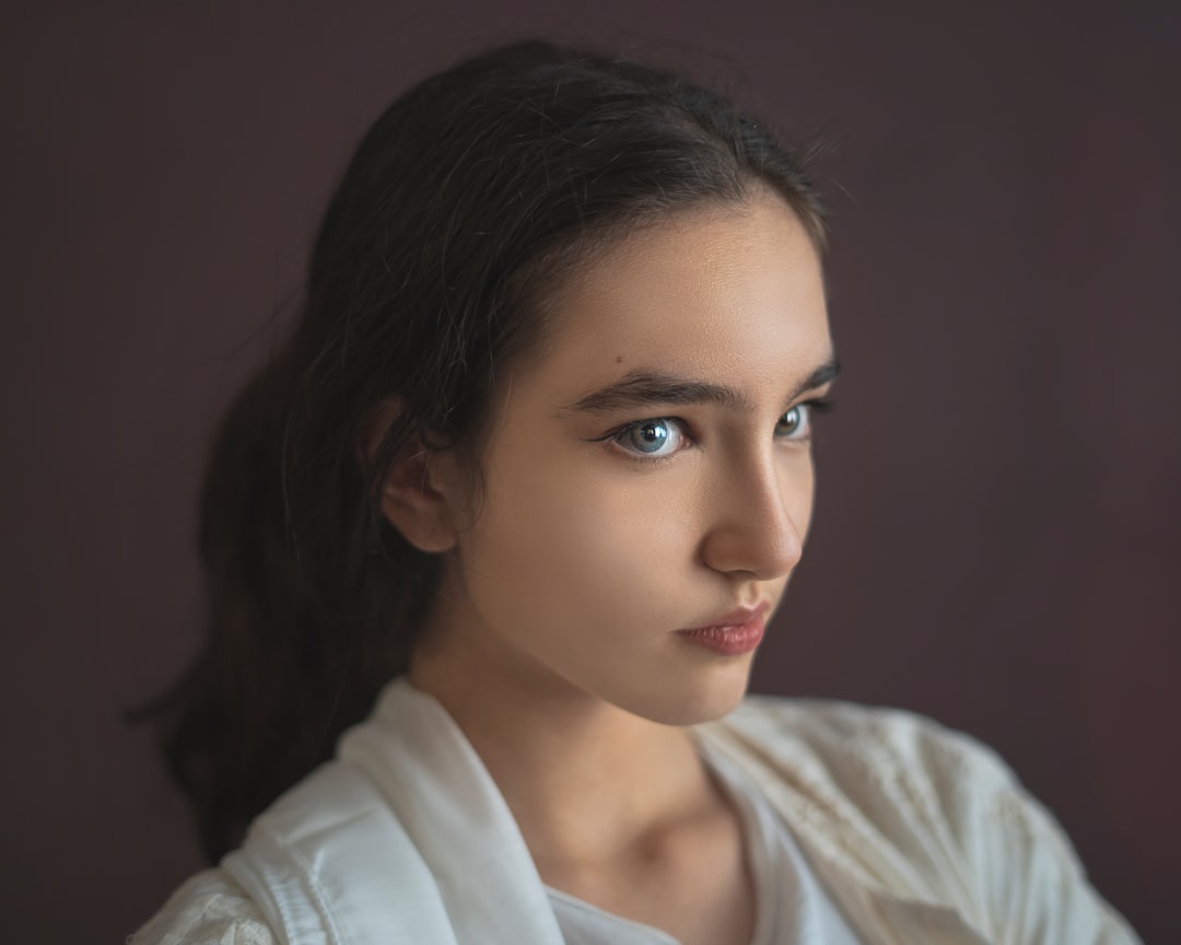 a close up of a person wearing a white shirt,