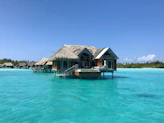 A luxurious overwater bungalow surrounded by turquoise water