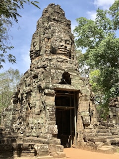 a large stone structure with a door in the middle of it