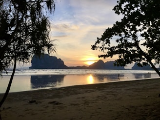A serene beach sunset in a popular travel destination.