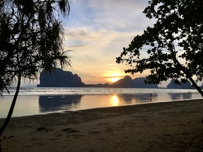 A serene beach sunset in a popular travel destination.